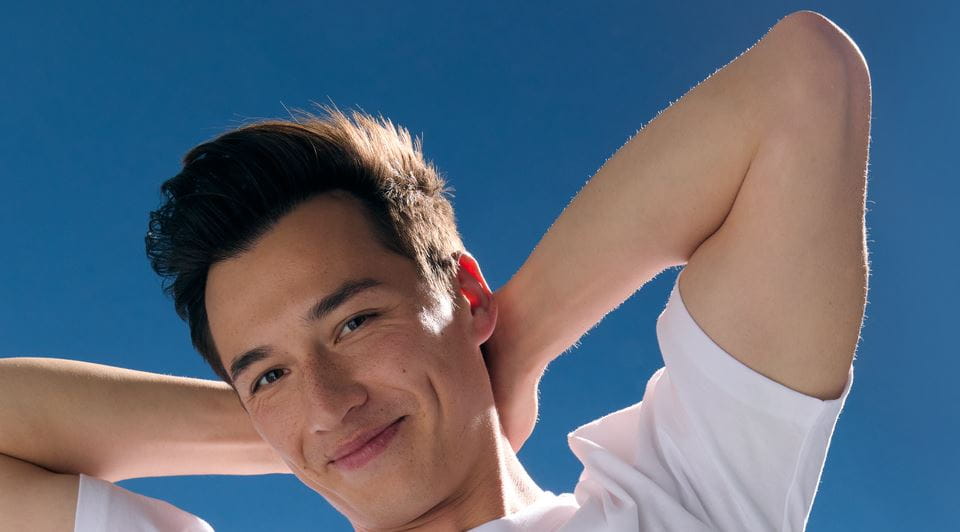 Men smiling under the blue sky